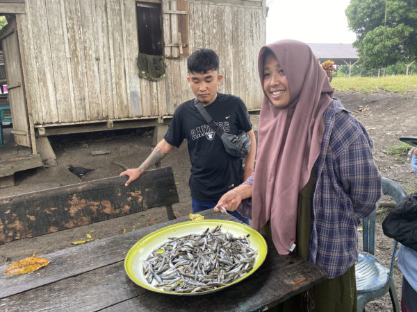 Chilo and Asnim visiting local to ask about fish